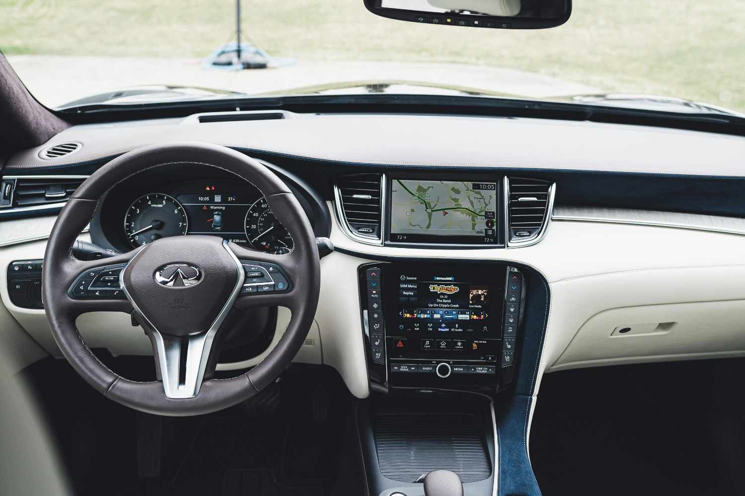 Driver's perspective inside a high-tech vehicle showing safety and premium comfort
